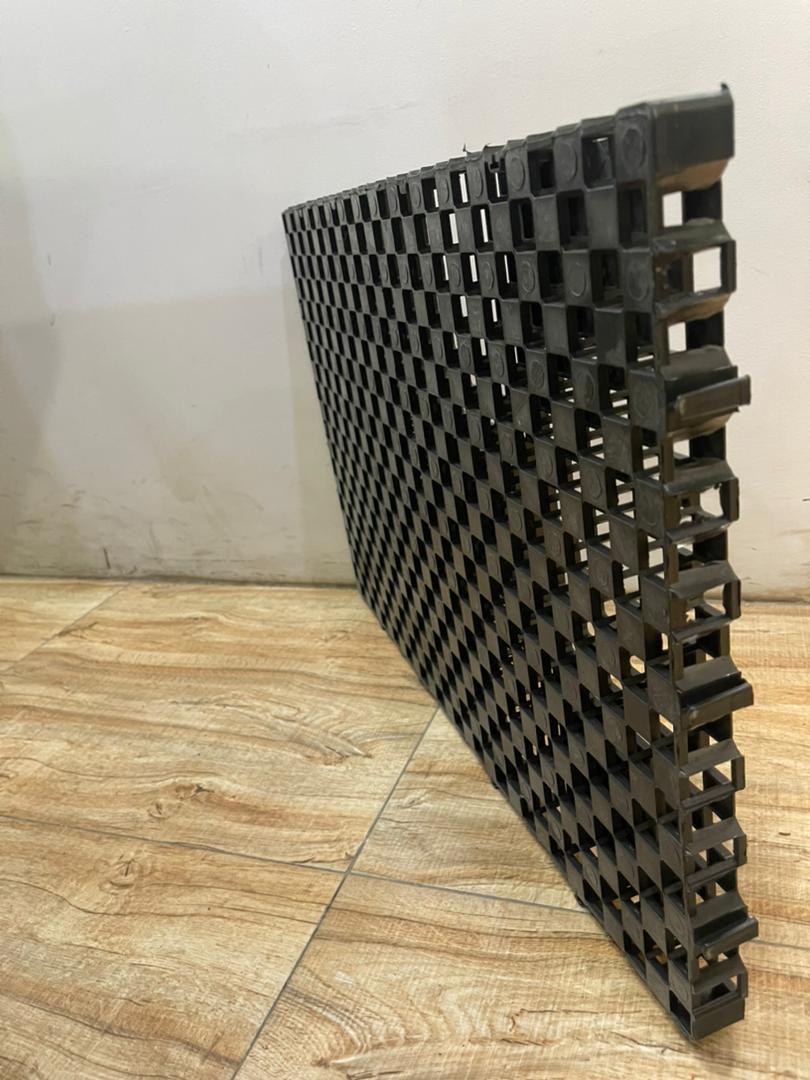 Black modular plastic drainage and reservoir grid panel